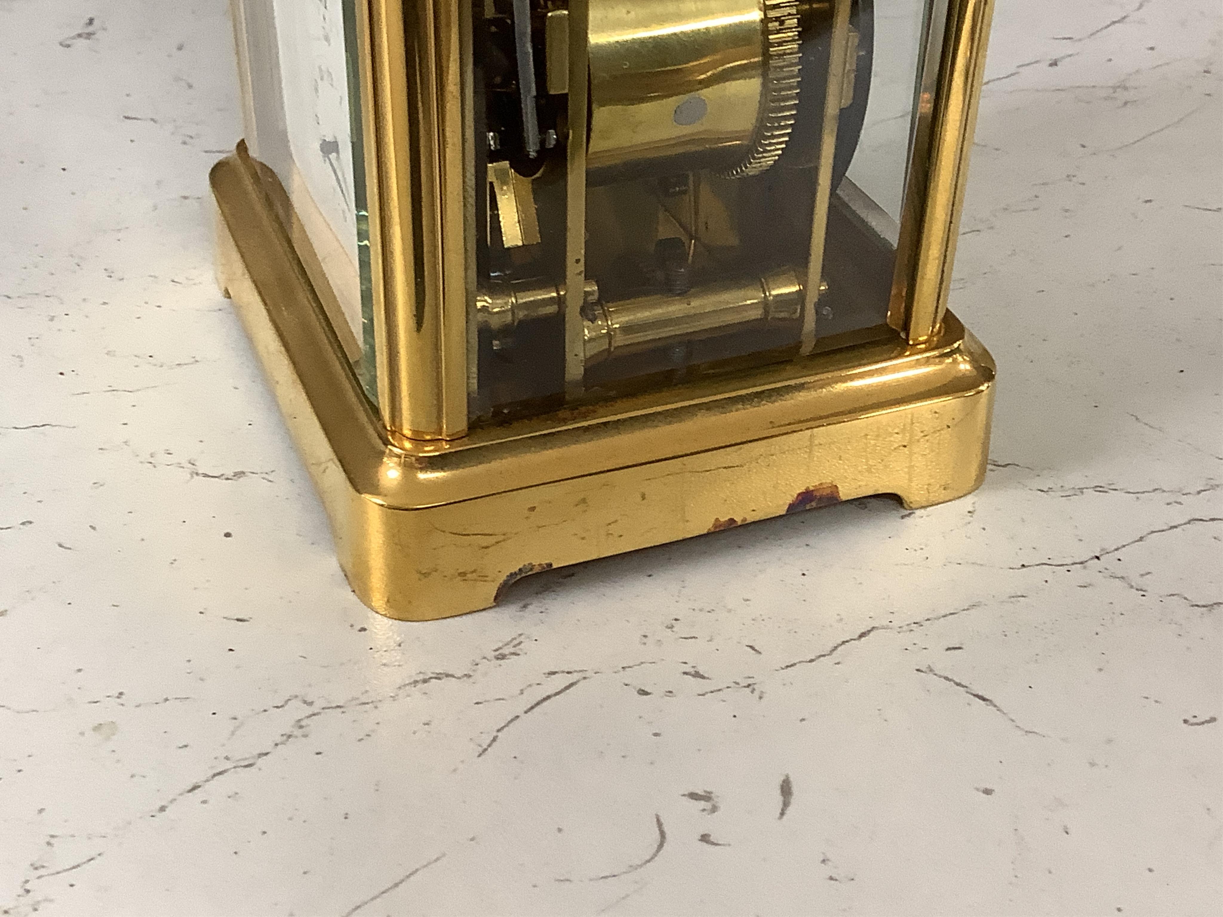 A French carriage clock with alarm, gong-striking movement, in a contemporary leather case, 17cm high